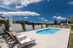 Pool. Swimmimg pool and sunbathing area
