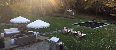 Beautiful entertaining patio and backyard with pool to enjoy the fall foliage!