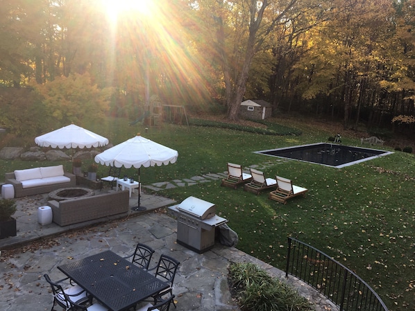 Beautiful entertaining patio and backyard with pool to enjoy the fall foliage!