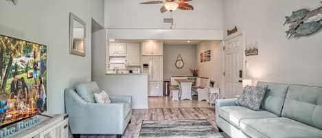 Comfortable living room with great natural light from ceiling skylight & balcony