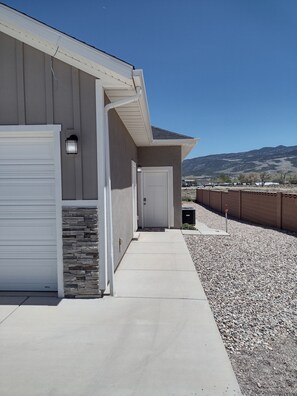 Entrance to basement suite is on south side (right hand side)