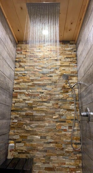 Large walk-in tiled shower. Enjoy the rain head above and/or the hand wand