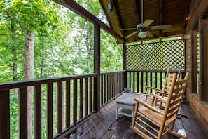 Private deck with table and chairs to enjoy the view.