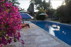 The pool at sundown in August 2021 with the new liner in place.