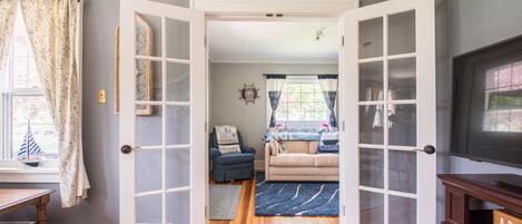 Entrance to fully air conditioned front porch with full-sized sofa sleeper