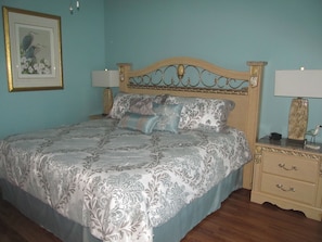 Master Bedroom features a king size bed and  wood floors. Also, has a smart TV.