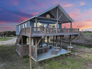 Enjoy the soothing sound of waves crashing, while relaxing on the large deck!