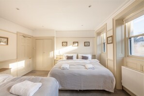Bedroom 3: 2 Super Kings or 4 singles beds. Each bed has pocket sprung mattresses which are dressed in Egyptian cotton linen. Perfect for families or friends