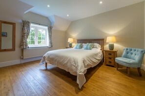 1 Hall Lane Cottages, Thornham: Master bedroom with king-size bed and Freeview television