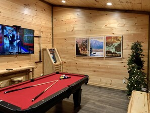 Multicade arcade and pool table opening to the deck