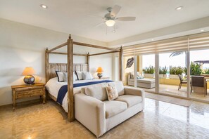 Ocean-view master bedroom with king-size bed
