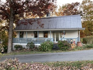 Fall.  Metal roof and front porch—country living at its best!