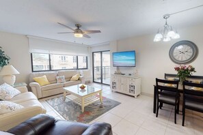 Living room has access to the open balcony with Gulf of Mexico views!