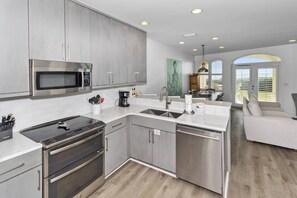 The kitchen is fully equipped with everything you need to cook delicious meals on those nights you want to stay in