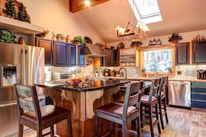 Kitchen and main dining table with seating for 12