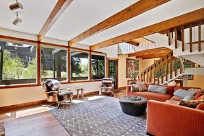 Family room with gas fireplace and mounted TV