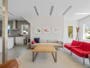 Primary seating area, lots of space and additional ottomans