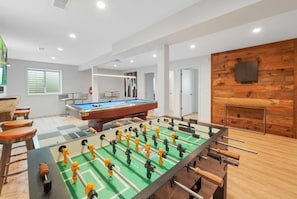 Commercial grade Foosball table, and darts area