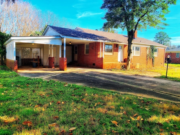 Ranch home with carport on a quiet street. Parking in driveway & street.