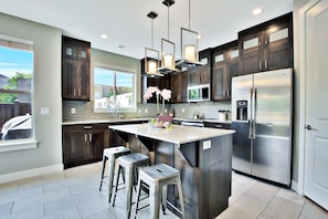 Entrada at Moab 417- Kitchen Area with Appliances & Island in the middle