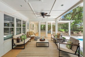 Plenty of seating on the screened-in porch