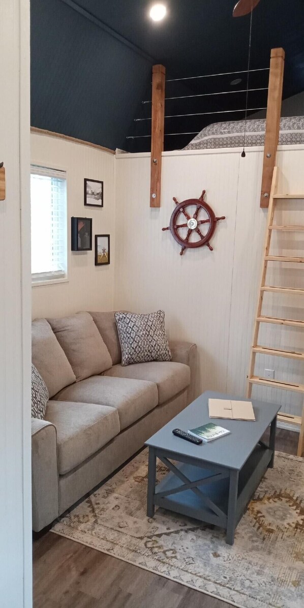 Living room is open to loft bedroom 