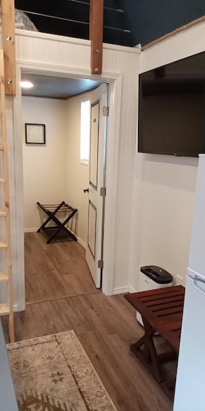 50” smart TV and stools for extra seating in the living room