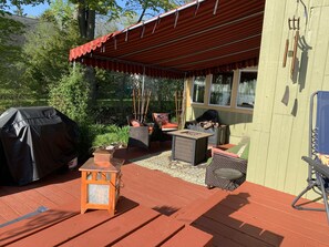 Side porch. Complete w a comfy couch, chairs and a propane fire pit 