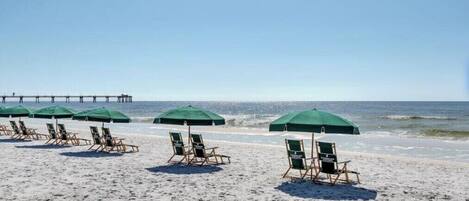 2 complementary beach chairs and umbrella each day