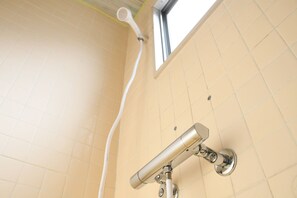With shower and toilet