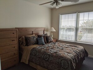 Guest Bedroom #2 with a tv, plenty of storage and natural light.