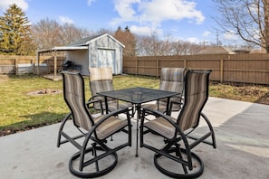Back patio with seating for 4 and fire pit. Fenced in backyard