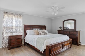 Main bedroom suit with king sized bed and 3/4 bathroom with shower