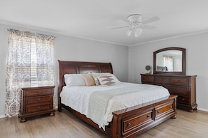 Main bedroom suit with king sized bed and 3/4 bathroom with shower