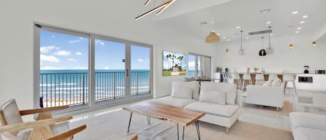 Open concept living and dining area overlooking the Gulf of Mexico