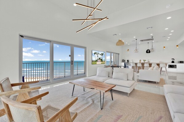 Open concept living and dining area overlooking the Gulf of Mexico