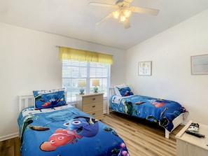 Cozy kids’ bedroom with themed decor, perfect for family fun and a restful stay.
