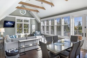 Dining and living rooms with view of bay and southern tip of San Juan Island