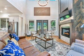 The living room is centered around the luxury fireplace and flat screen tv.