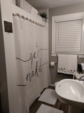 bathroom with a shower/tub combination