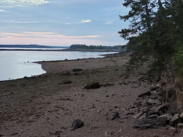 Private beach in front of the main cabin