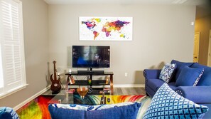 Stream your favorite shows and charge all of your devices. 50" Smart TV & games.
