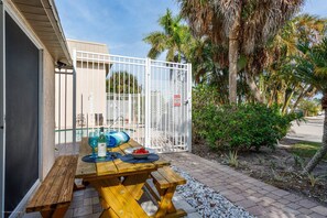 Sliders off the living room lead to the open patio with your private picnic table.  Enjoy a snack or meal in the Florida sunshine.