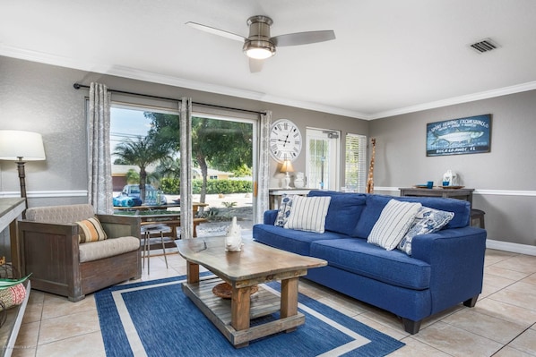 New sofa sleeper and coffee table (1/24) sliding doors go out to the open patio.  Community pool steps away!