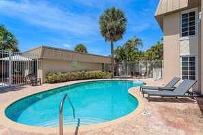 Heated community pool with loungers and tables for "hanging out" every afternoon