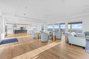 The third floor is an open concept living, dining and kitchen.