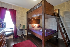 The Gryffindor dormitory features a custom made canopy bunk bed with two full size beds.