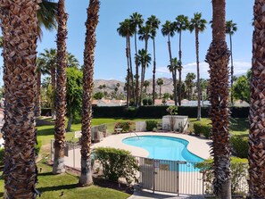 balcony view of pool and mountains