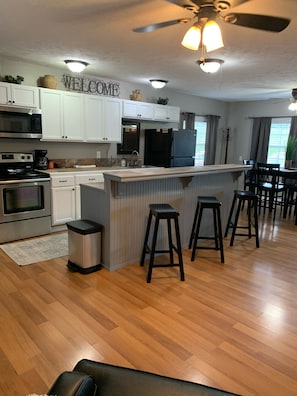 Open floor plan living/dining/eat-in kitchen