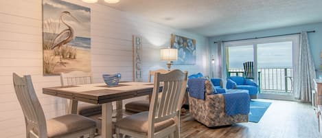 Remolded Great Room  Shiplap Walls New dning and Living Room Furniture New Sliding Glass Door Direct Oceanfront View